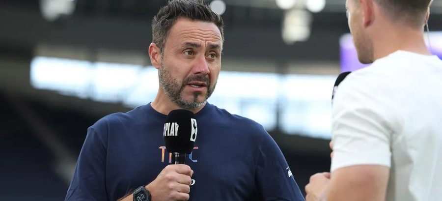 Roberto De Zerbi speaks to broadcasters at the Tottenham Hotspur Stadium